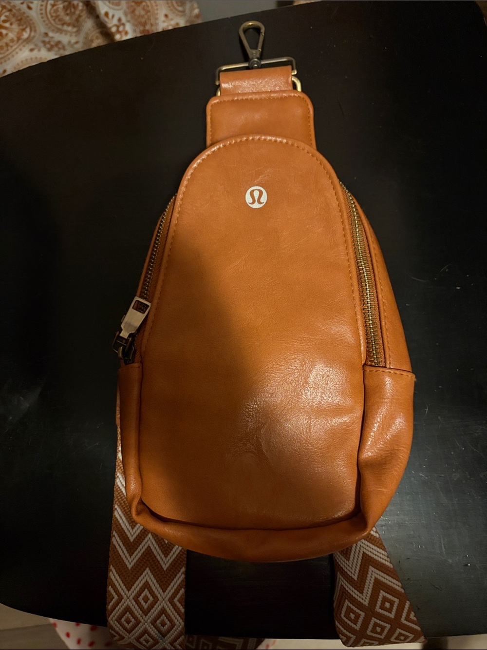 lululemon athletica Tan Leather Sling Bag with Patterned Strap